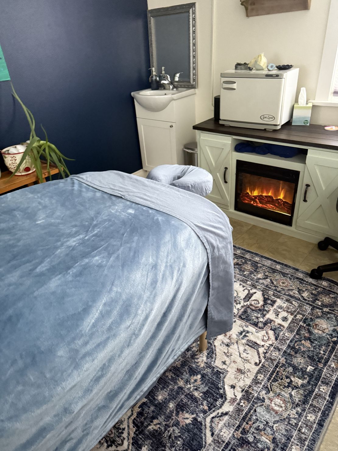 Prepared therapeutic massage treatment room ready for client care in Anchorage Alaska